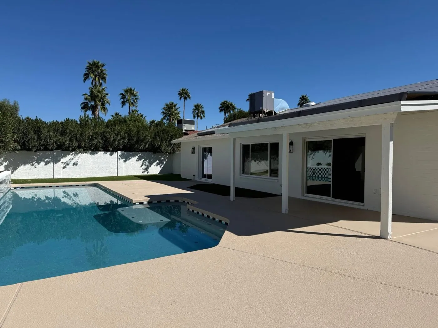 Full exterior renovation with pool and stucco