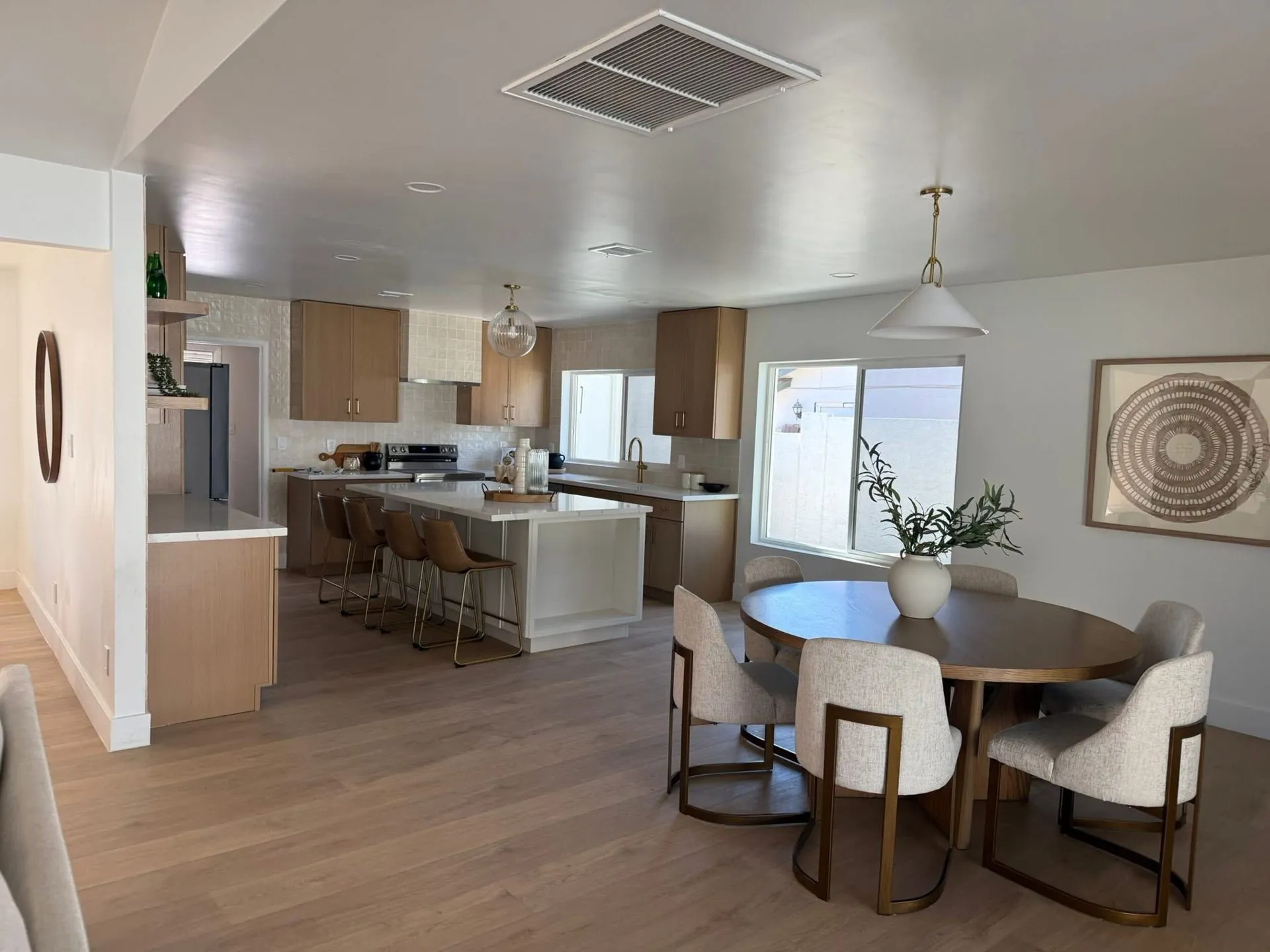 Precision Renovation open-concept kitchen and dining remodel